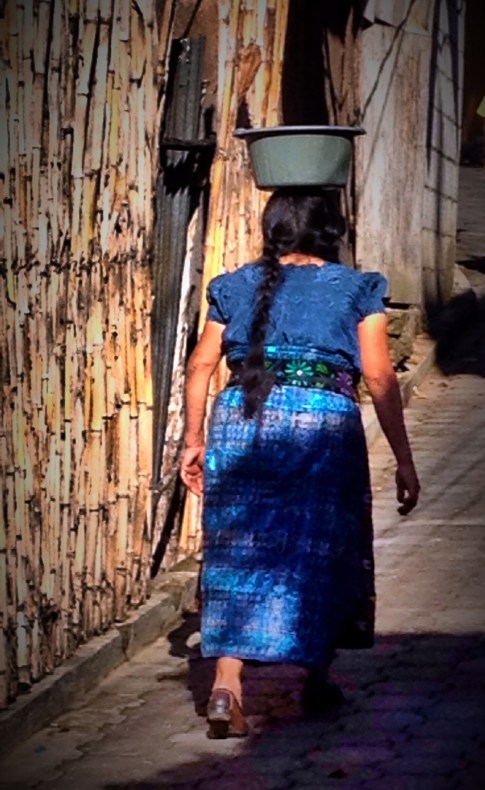 The Mayan women all carry their cargo this way