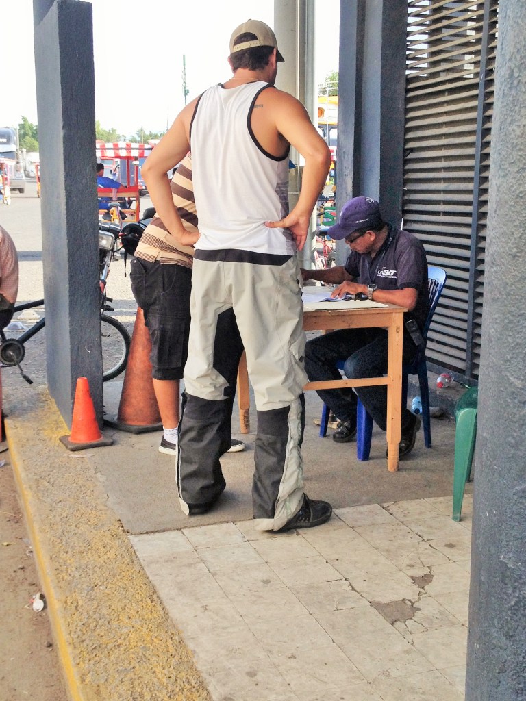 first step find a guy sitting at a random desk marked by a pylon to stamp my moto exit papers