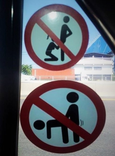 a reminder sticker inside our taxi that no fun will be had on his watch