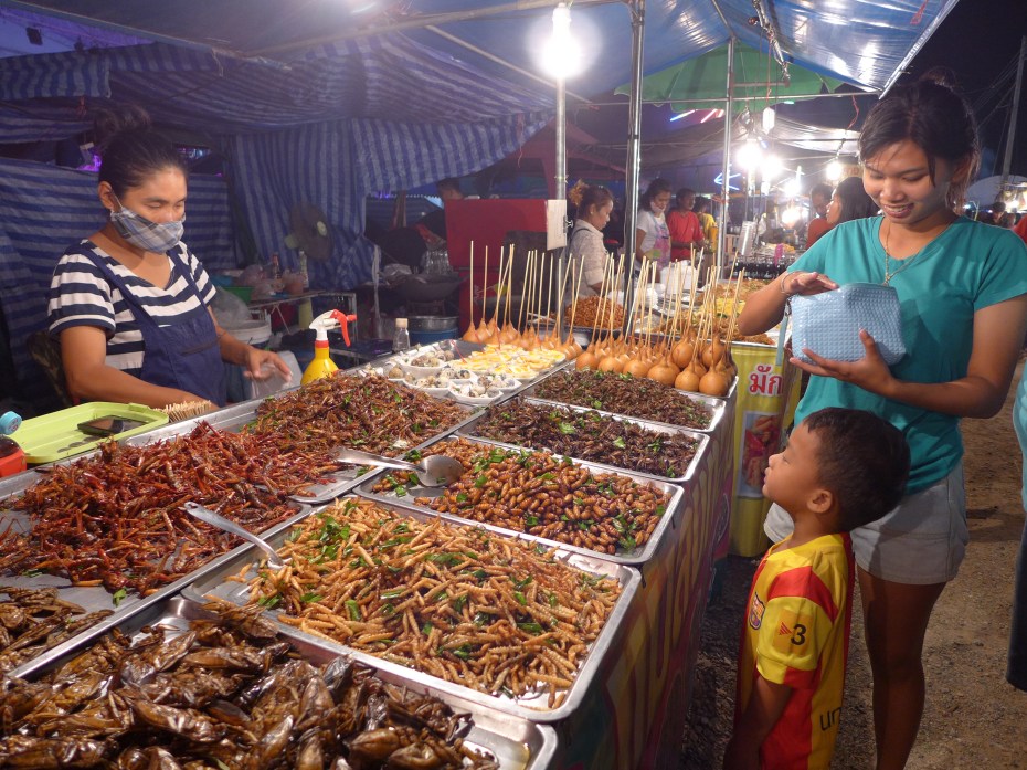 this mom and son were buying a bag of creepy crawlers to snack on 