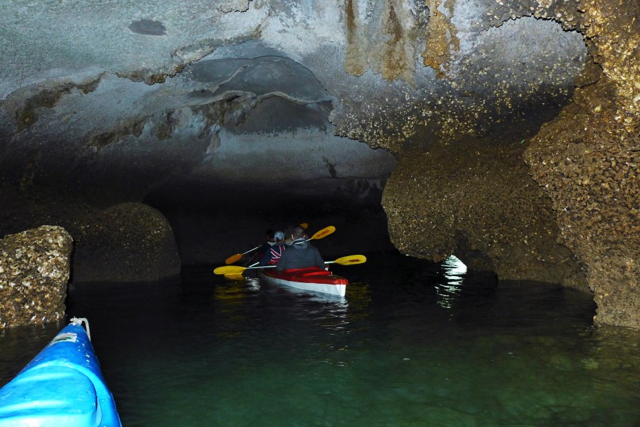 Thru the "secret" cave.